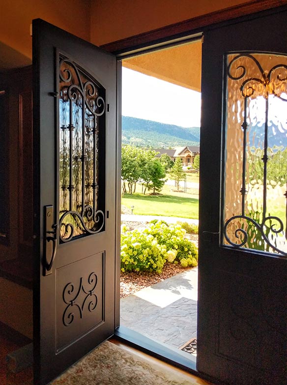 Custom double door iron entry Spanish style, Flemish glass, Patented Thermal Break, Hand Rubbed Bronze finish