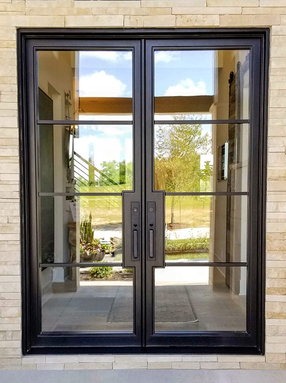 Custom double door iron entry with 2” stiles and 1” mullions, clear glass, custom door pulls, black finish Patented Thermal Break