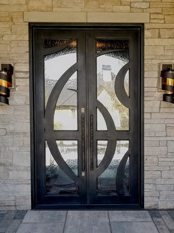 Close-up of adjacent custom contemporary designed double door iron entry