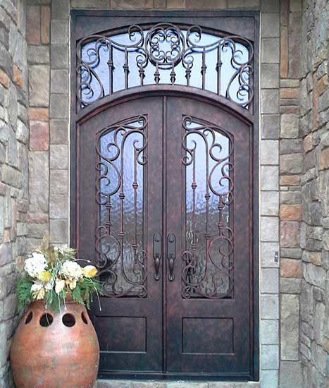 Arched double iron entry doors w/ transom, French Country style, stock Chateau Collection, Patented Thermal Break, antique copper finish, Flemish glass