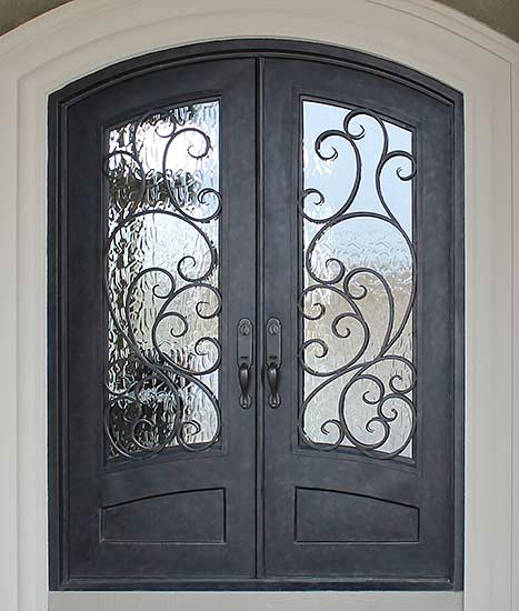 Double iron door arched top front entry, Spanish style, Santa Cruz stock Collection, operable iron grill, Patented Thermal Break, hand-rubbed bronze finish