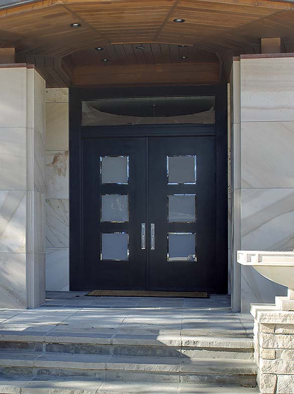 Custom modern double door front entry, black stain on white oak, art glass panels, rectangular transom