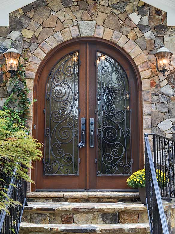 French Country style round top double entry doors, Mahogany, operable iron scroll grill, full light Flemish glass, Half Round Collection