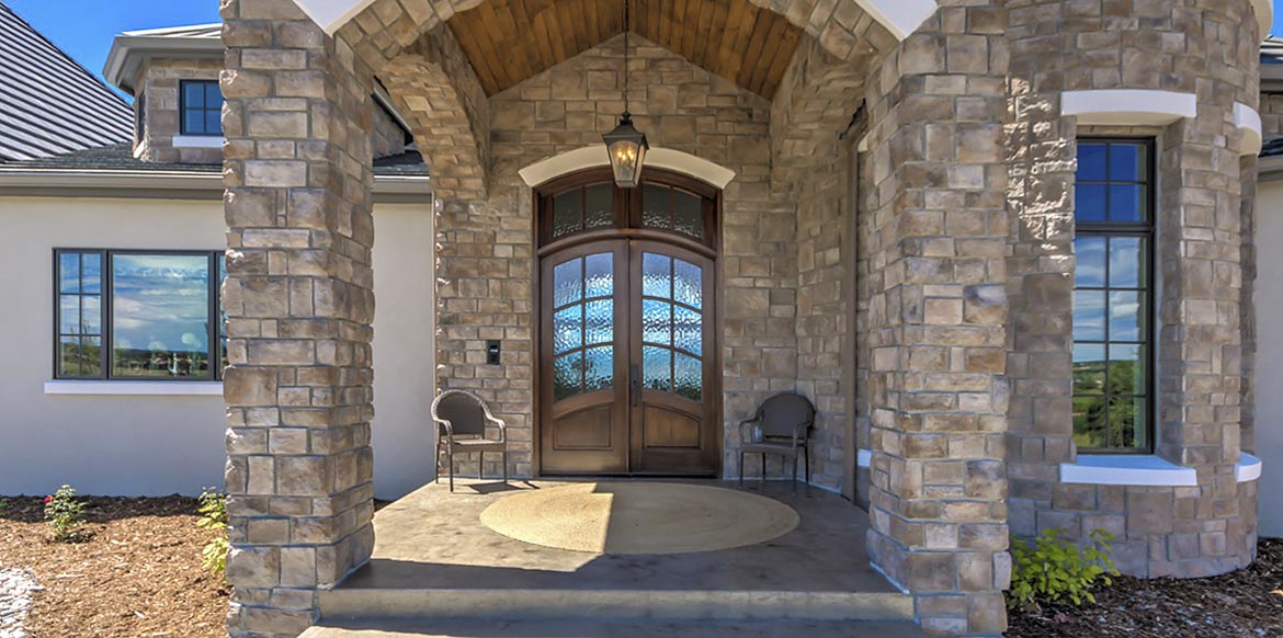 French Country Style arched double exterior doors with arched divided light transom, Knotty Alder, Flemish arched glass panels, Aberdeen Collection